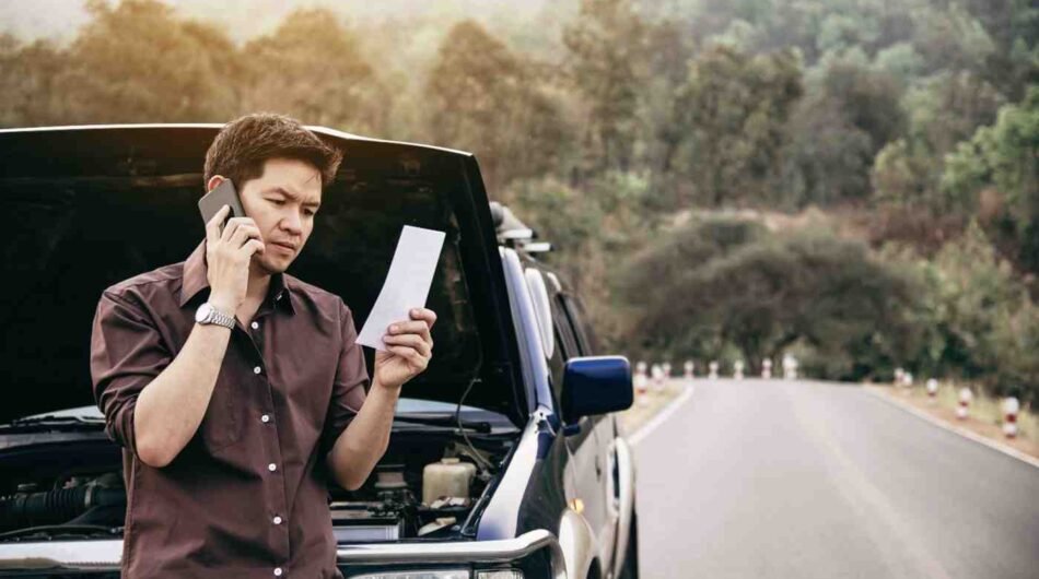 man-try-fix-car-engine-problem-local-road-1