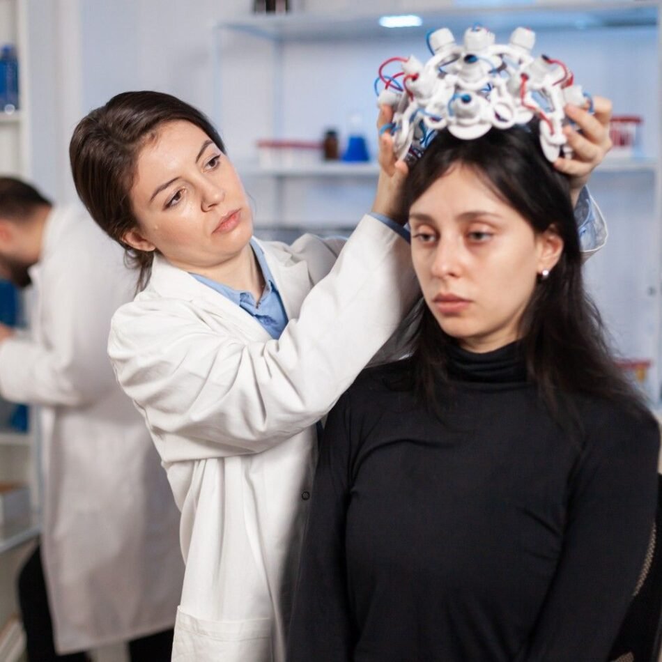 neurologist-moden-clinic-preparing-patient-headset-with-sensors-brain-scan-with-high-tech-technology-device-tomography-searching-diagnosis-ill-nervous-system-1