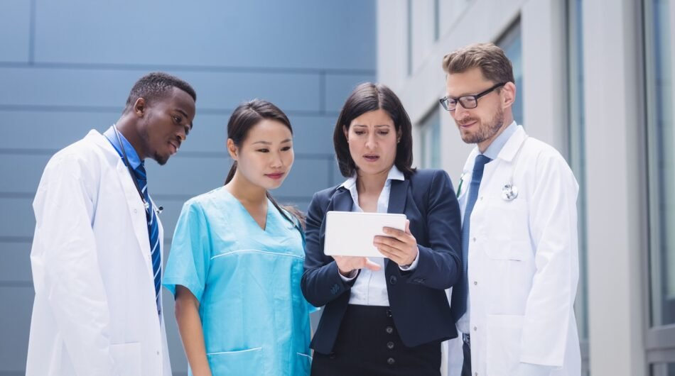 team-doctors-looking-digital-tablet_107420-84759