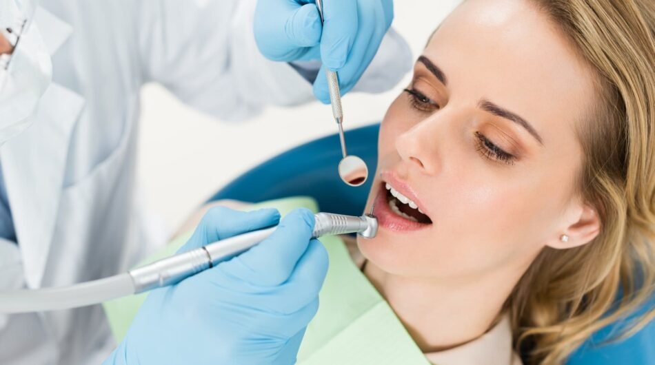 doctor-using-dental-drill-during-procedure-in-modern-dental-clinic