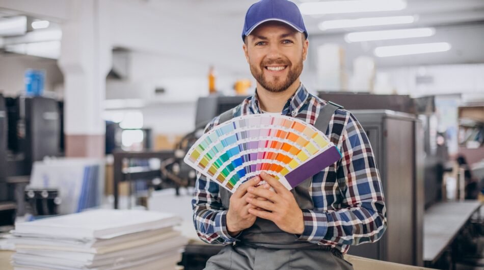 man-working-printing-house-with-paper-paints-1